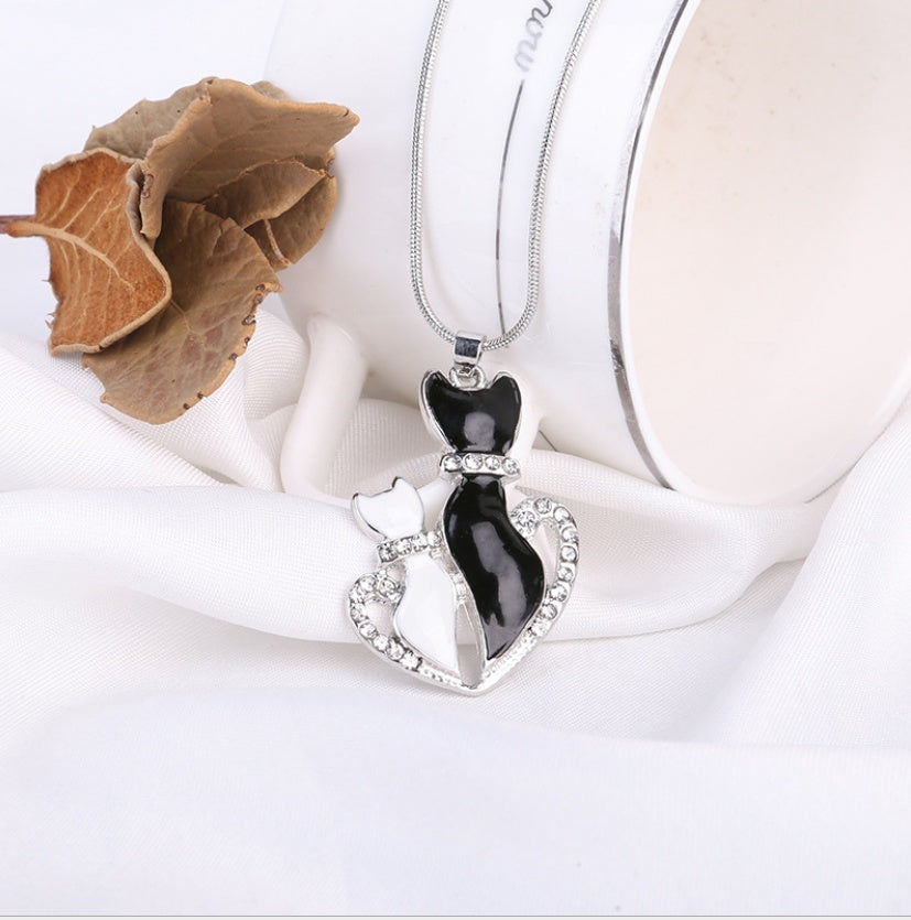 Cats in Love Heart Necklace – Black & White Crystal Pendant